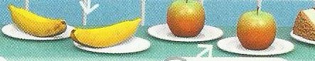 Bananas, apples and cake on plates