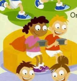 Two children on a sofa, each holding a computer game