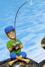 A boy in a blue cap sitting on a rock with a fishing rod and a fish