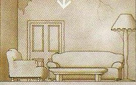 A living room with a sofa, an armchair, a table and a lamp