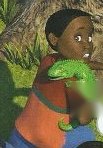 A boy with a green lizard on his shoulder