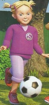 A girl in a purple top kicking a football