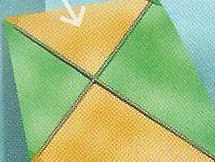 A green and orange kite