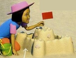 A girl in a pink hat building a sandcastle with a red flag
