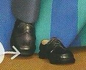 A pair of black shoes on a wooden floor