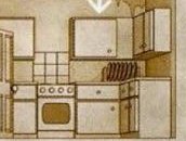 A kitchen with an oven, a sink and cupboards
