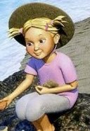 A girl in a straw hat sitting on a rock and looking at a shell in her hand