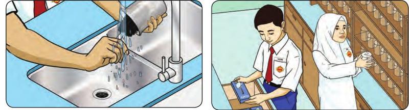 A pupil washes a beaker at the sink; two pupils put apparatus on shelves