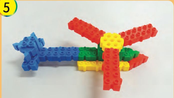 The finished helicopter model with red blades