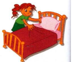 A girl tidying the pillow on a bed