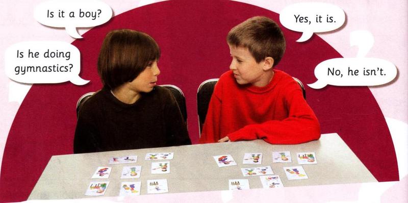 Two boys play a guessing game with picture cards. Is it a boy? Yes, it is. Is he doing gymnastics? No, he isn't.
