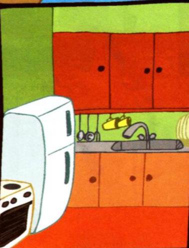 A kitchen with red cupboards, a sink, a white fridge and a cooker