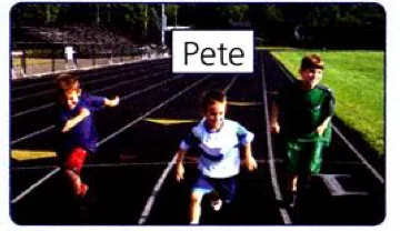 Three boys running on a track; Pete is in front