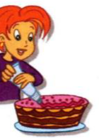 A girl putting cream on a cake