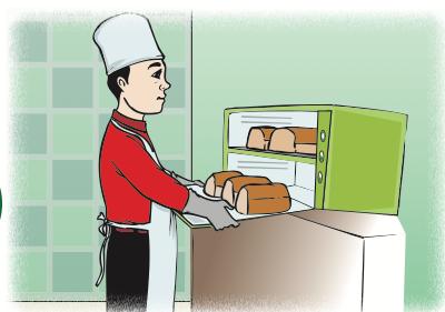 Pengusaha makanan memakai apron, sarung tangan dan penutup kepala