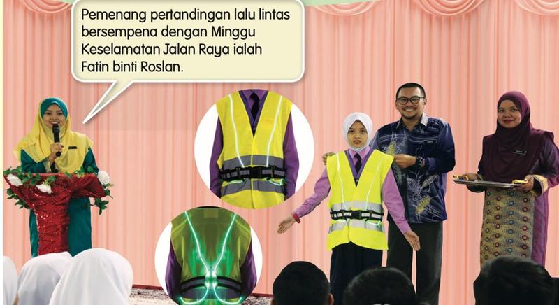 Guru Besar menghadiahkan jaket keselamatan kepada pemenang pertandingan lalu lintas