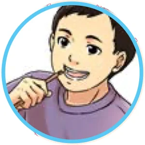 Budak lelaki menggosok gigi dengan kayu sugi
