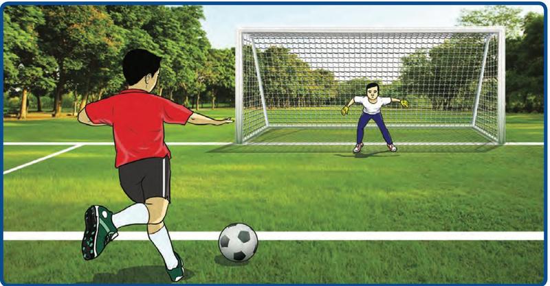 Seorang budak bersedia menendang bola ke arah gol yang dijaga oleh seorang penjaga gol