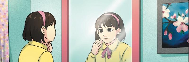 Seorang murid perempuan melihat imejnya pada cermin