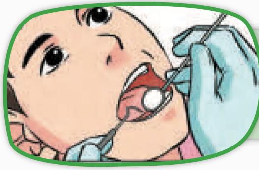 A dentist using a small mirror to see inside a patient's mouth