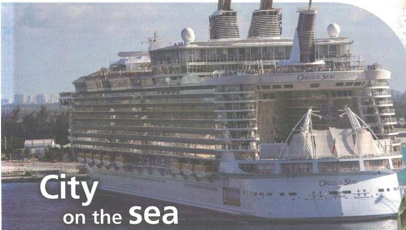 A very large white cruise ship in a port