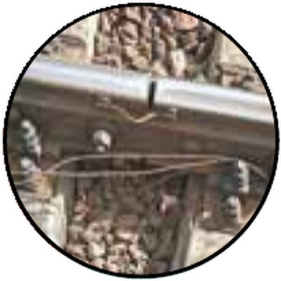Close-up of a railway track showing a small gap between the ends of two rails