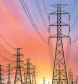 Photo of electric cables hung between tall electric poles