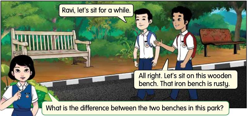 A wooden bench and a rusty iron bench in a park