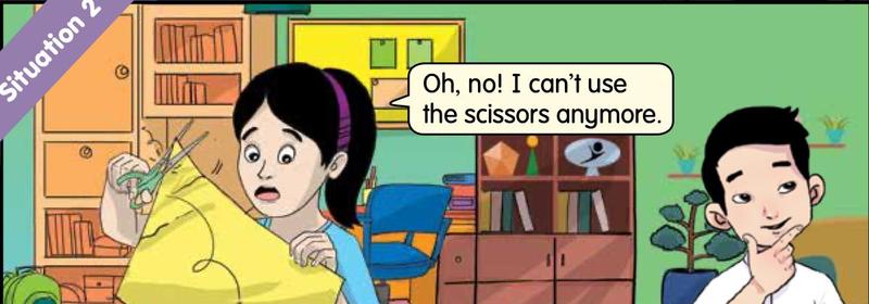 A girl looking at a pair of scissors that she can no longer use