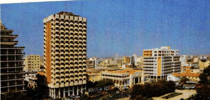 Dakar, the capital of Senegal: tall buildings, a square with trees and a fountain